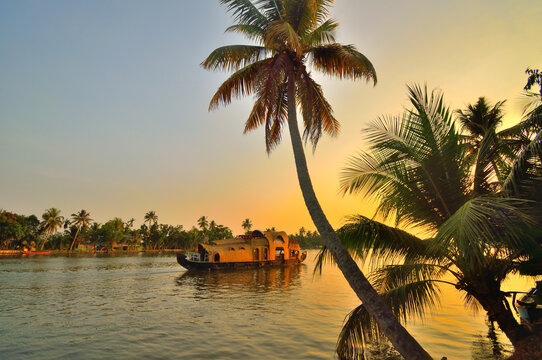 A houseboat drifting the Kerala backwaters at dusk — ZnVO's ground-zero destination